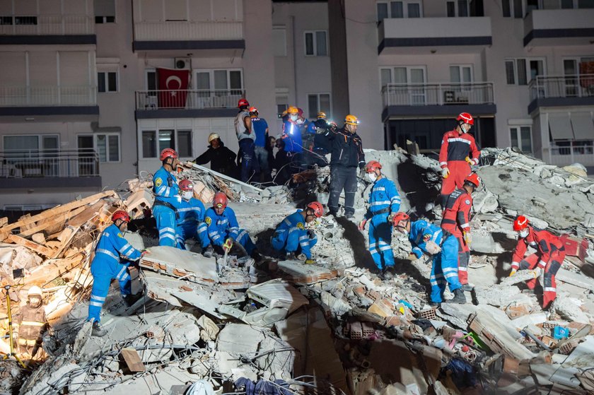 Rescue operations take place on a site after an earthquake struck the Aegean Sea, in the coastal pro