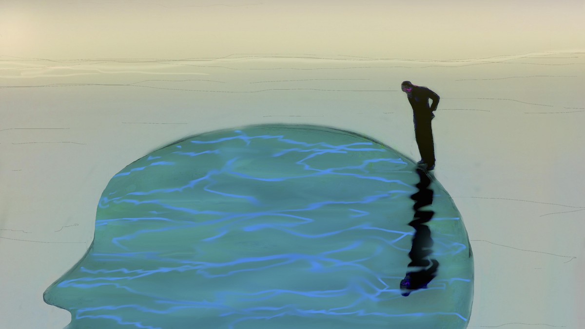 Man looking down into tranquil water inside of head profile