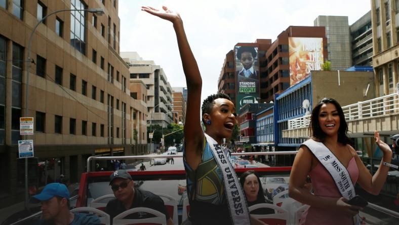Miss Universe, Zozibini Tunzi (L) waved to crowds who came out to greet her and celebrate her victory