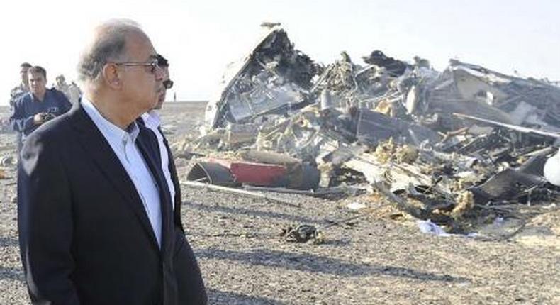 Egypts Prime Minister Sherif Ismail looks at the remains of a Russian airliner after it crashed in central Sinai near El Arish city, north Egypt, October 31, 2015.