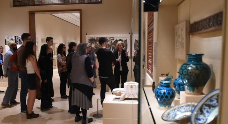 Curators at the Metropolitan Museum of Art talk to visitors about works created in the lands that are now Iraq, Syria, Iran and Yemen, four of the seven countries affected by the recent travel ban