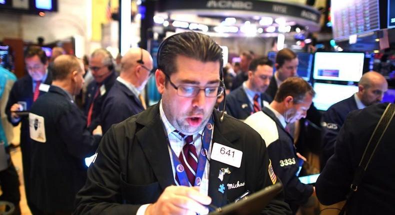 Traders work during the opening bell at the New York Stock Exchange (NYSE)