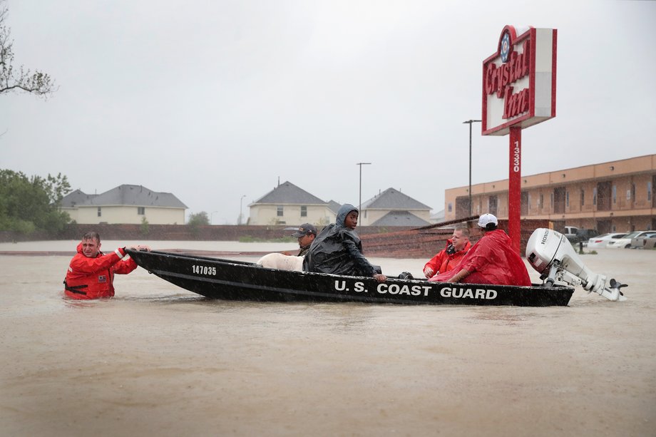 People are rescued from a flooded neighborhood after it was inundated with rain water, remnants of Hurricane Harvey, on August 28, 2017 in Houston, Texas.