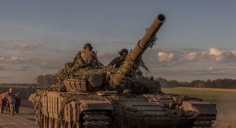 Ukrainian serviceman operating a tank.ROMAN PILIPEY/AFP via Getty Images