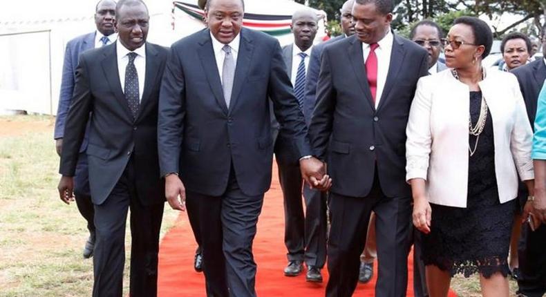 President Uhuru Kenyatta, his Deputy William Ruto and health CS Sicily Kariuki walk with National Assembly Speaker Justin Muturi