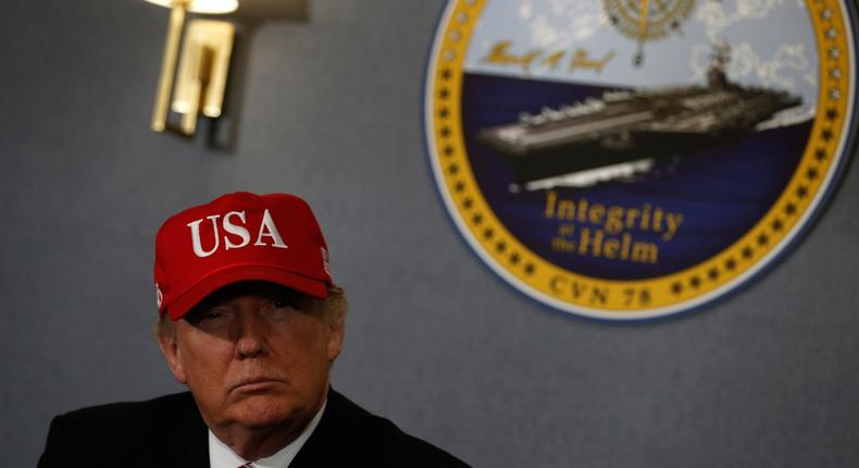 President Donald Trump gets a briefing before he tours the pre-commissioned US Navy aircraft carrier Gerald R. Ford at Huntington Ingalls Newport News Shipbuilding facilities in Newport News, Virginia, on Thursday.