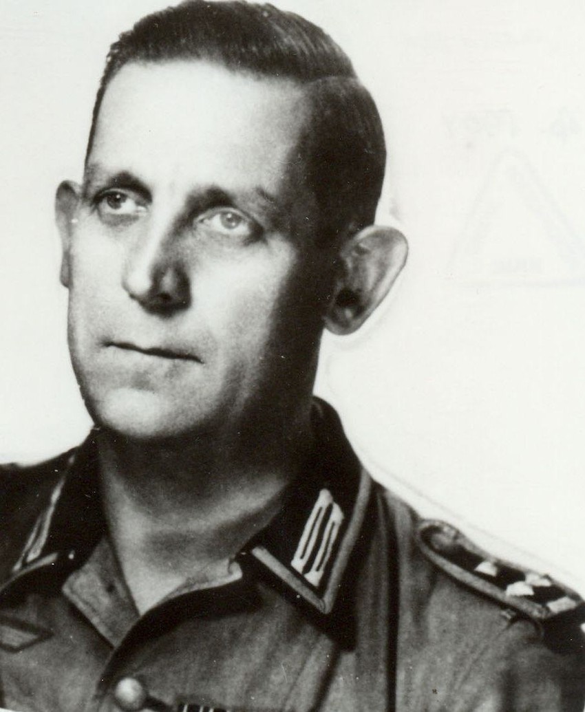 Hajnrih Brant - Kapetan (na kraju rata potpukovnik) Hajnc Hajnrih Brant, šef odeljenja Anti DM (Dragoljub Draža Mihailović) odseka Gestapoa 