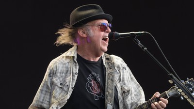 Neil Young performing live on stage in Hyde Park in London