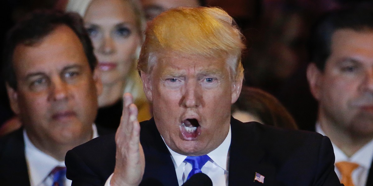 Republican US presidential candidate Donald Trump speaks, as New Jersey Gov. Chris Christie (left) looks on, during Trump's five-state primary-night event in New York City on April 26.