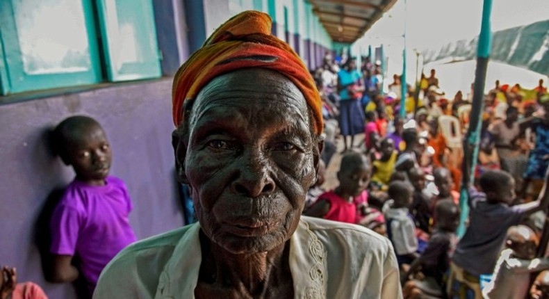 A woman arrives to watch the screening of the start of the International Criminal Court trial of former child soldier-turned-warlord Dominic Ongwen in Lukodi, Uganda on December 6, 2016