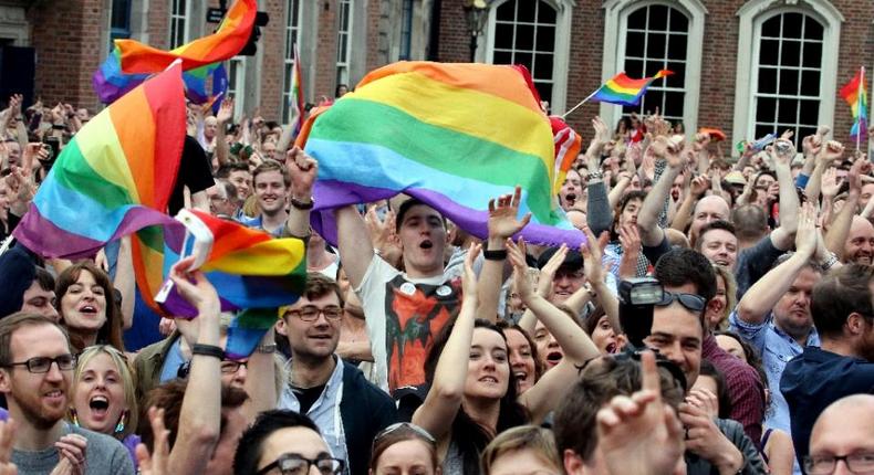 Supporters outside Dublin Castle cheer the result of the same-sex marriage referendum on May 23, 2015 