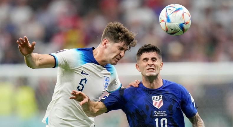 Christian Pulisic fights for a header against England in the World Cup.AP Photo/Luca Bruno