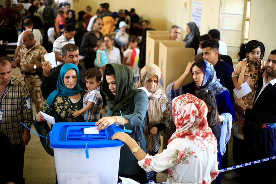 A woman casts her vote during Kurds independence referendum in Kirkuk, Iraq, September 25, 2017.