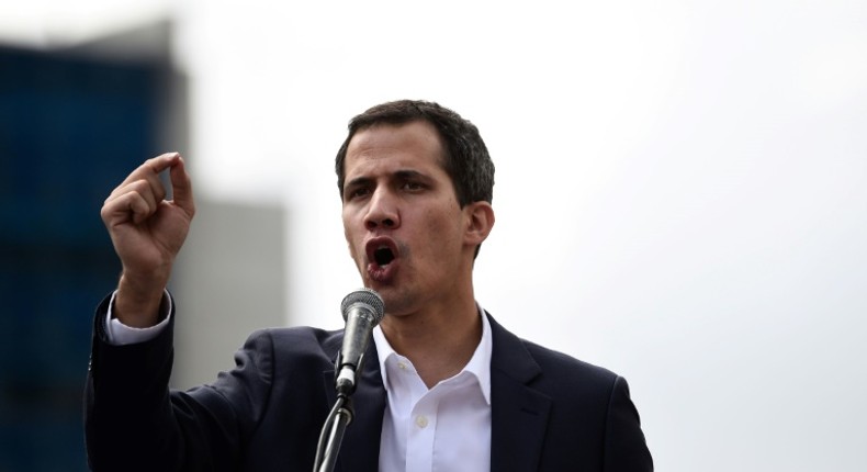 Venezuela's National Assembly head Juan Guaido speaks to the crowd during a mass opposition rally against leader Nicolas Maduro in which he declared himself the country's acting president