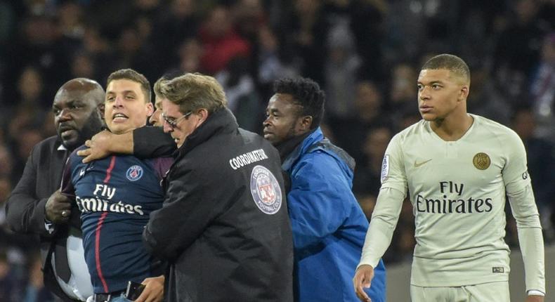 He only wanted a picture: the fan who ran on the field to take a selfie with Kylian Mbappe has been fined and banned