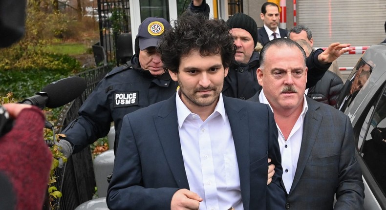 FTX founder Sam Bankman-Fried leaves following his arraignment in New York City on Thursday.ED JONES/AFP via Getty Images