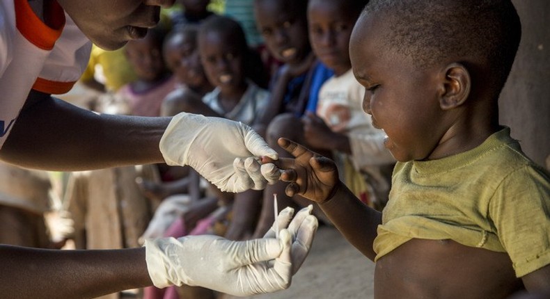 A boy in Busia, Western Kenya, has a rapid diagnostic malaria test