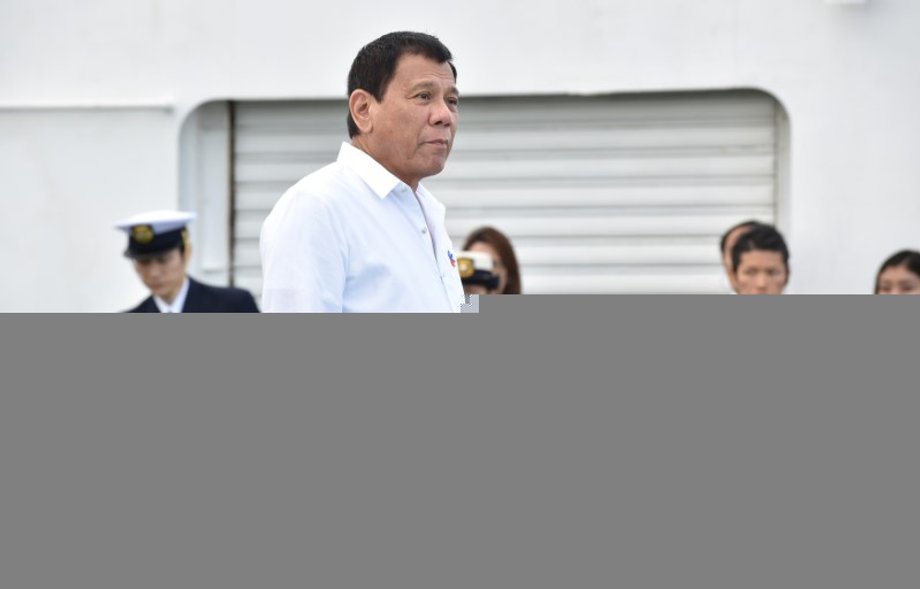 Philippine President Rodrigo Duterte inspects Japan's coast guard drills in Yokohama, Japan, October 27, 2016.