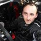 Robert Kubica za kierownicą samochodu rajdowego drzwi otwarte