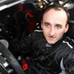 Robert Kubica za kierownicą samochodu rajdowego drzwi otwarte