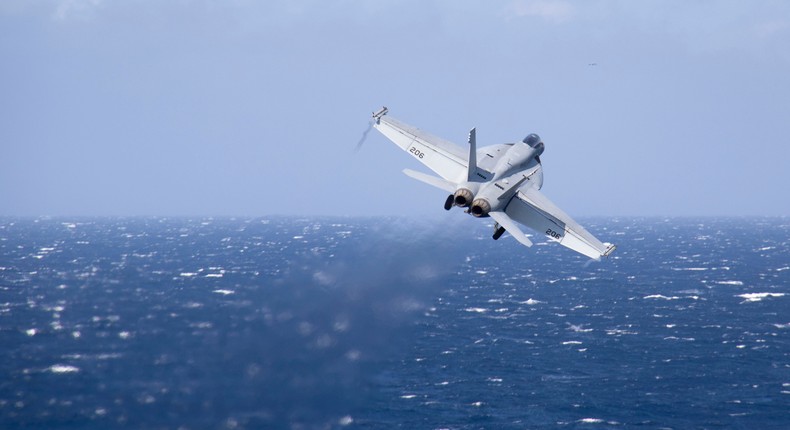 An F/A-18E Super Hornet, assigned to the Stingers of Strike Fighter Squadron (VFA) 113, launches from the flight deck aboard Nimitz-class aircraft carrier USS Carl Vinson (CVN 70) during Annual Exercise (ANNUALEX).U.S. Navy photo by Mass Communication Specialist 3rd Class Isaiah B Goessl