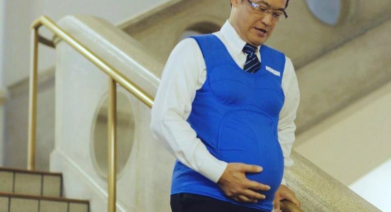 Japanese politician Shunji Kono wears a pregnancy vest in a video filmed by the Kyushu-Yamaguchi Work Life Balance Promotion Campaign