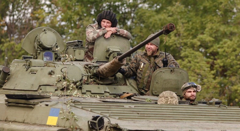 Ukrainian servicemen ride an amphibious armoured personnel carrier as they drive out of Bakhmut, Donetsk region, in eastern Ukraine, on September 7, 2022.