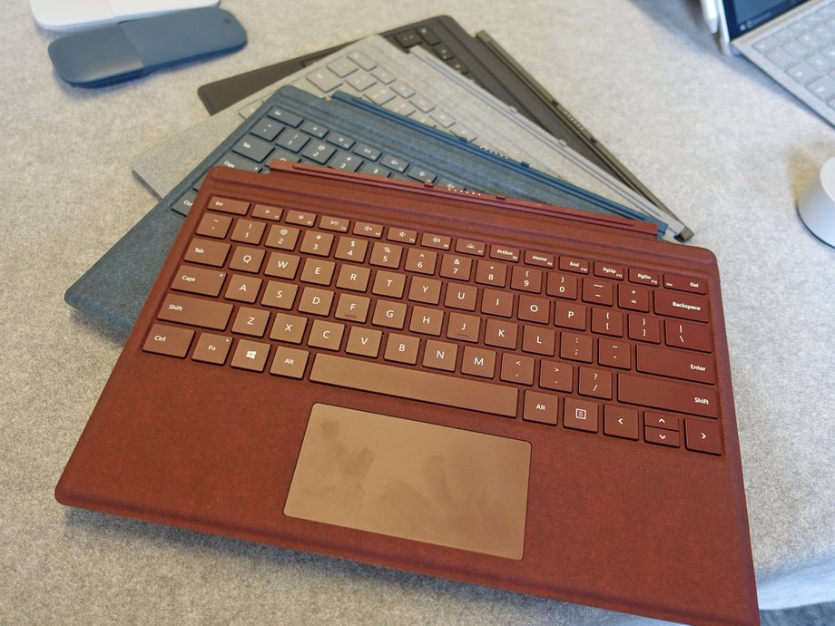 The new Type Cover keyboards for the Surface Pro. The black model costs $129, while the red, blue, and silver models cost $159 and are made of a warm alcantara fabric.