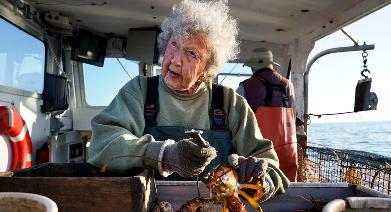 Virginia Oliver measures and bands lobsters on her son Max Oliver's boat.Robert F. Bukaty