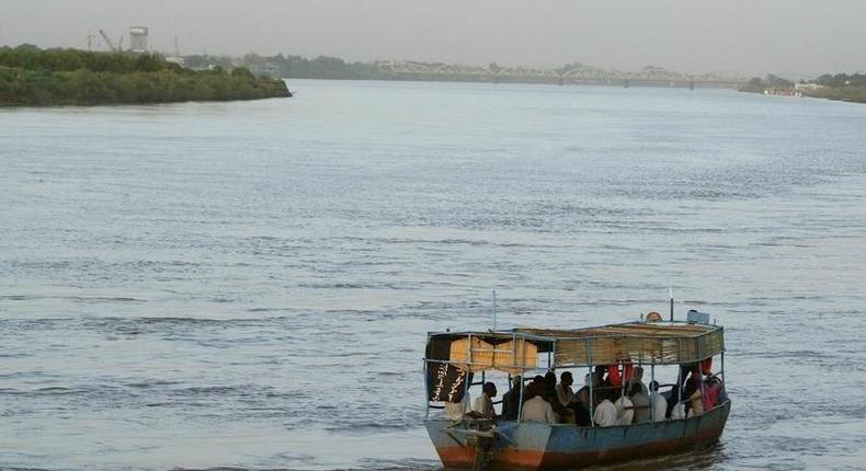 Sudanese villagers travel by boat on the river Nile in Sudan's capital Khartoum, September in a file photo. REUTERS/Antony Njuguna