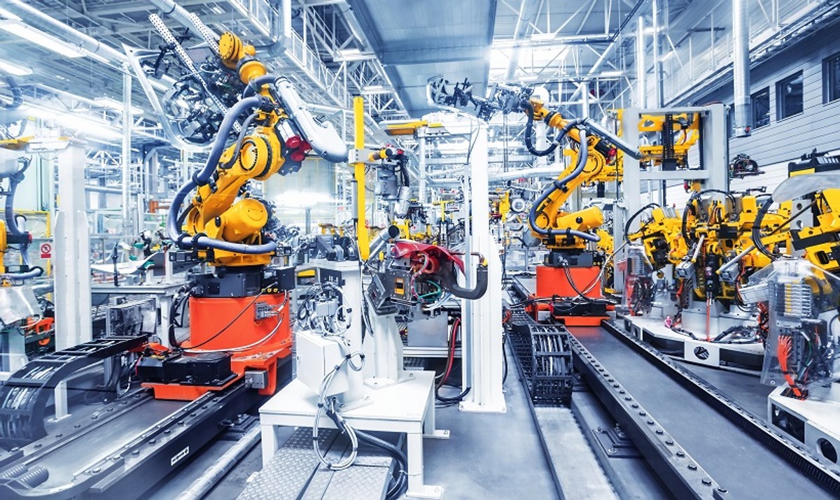 robotic arms in a car plant