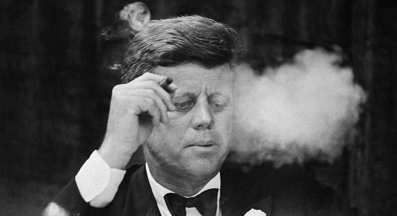 President John F. Kennedy smokes a cigar during a Democratic fundraising dinner at the Commonwealth Armory at Boston University.Getty Images