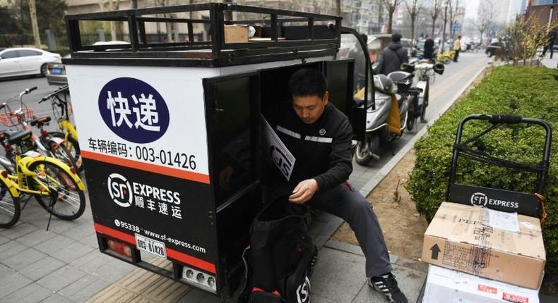 SF Express has an 80,000-strong staff -- using three-dozen aircraft and thousands of vehicles -- delivering throughout China's huge cities