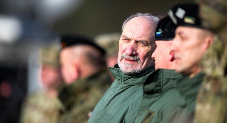 Polish Defense Minister Antoni Macierewicz (C), seen in January 2017, said he wants to stamp out all traces of the communist era in the military, by blocking promotions of servicemen who joined before the fall of the Iron Curtain in 1989