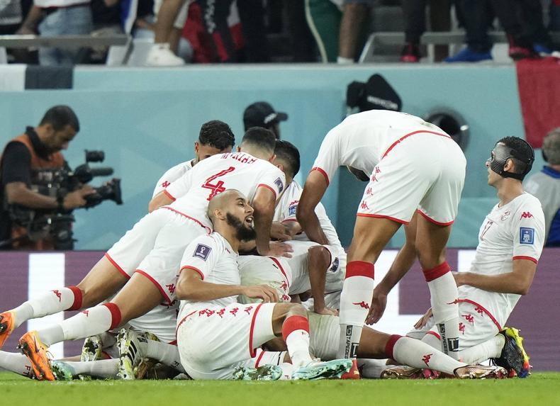 Tunisia celebrates the winning goal.