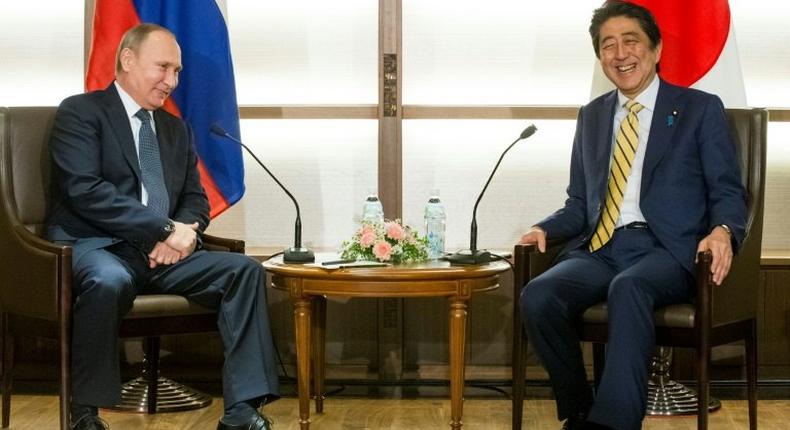 Japanese Prime Minister Shinzo Abe and Russian President Vladimir Putin at the start of a summit meeting in the Japanese city of Nagato on December 15