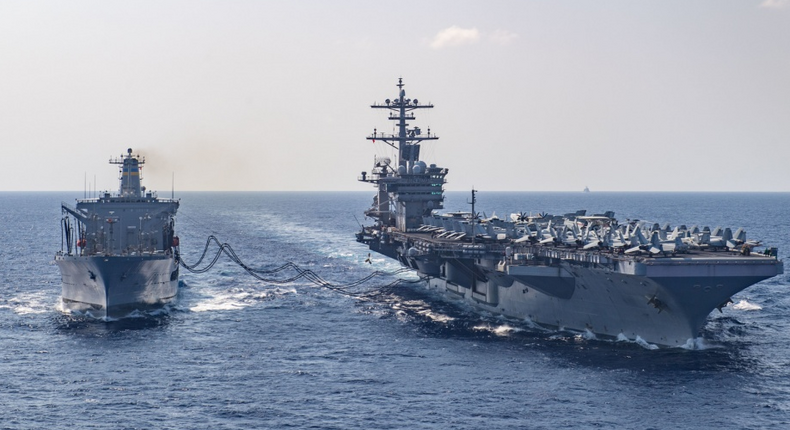 The aircraft carrier USS Theodore Roosevelt (CVN 71) receives fuel from the fleet replenishment oiler USNS Tippecanoe (T-AO 199) during a replenishment at sea March 17, 2020