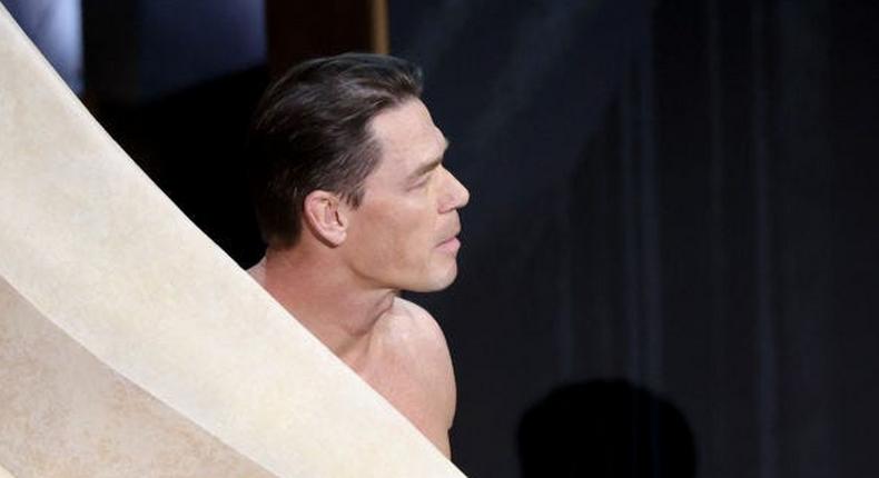 John Cena walked onstage nearly naked while introducing the nominees for best costume design.