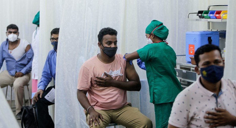 People are administered COVID-19 vaccine in Mumbai, India, Tuesday, April 13, 2021.
