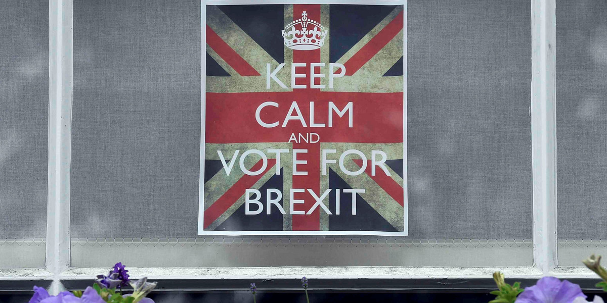 Vote leave posters are seen in a window in Chelsea, London