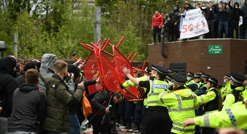 Scuffles broke out as police moved in to disperse Manchester United fans protesting outside Old Trafford