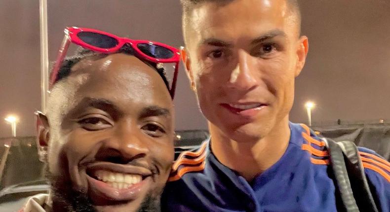 Ommy Dimpoz (left) poses next to Portuguese and Manchester United midfielder Cristiano Ronaldo