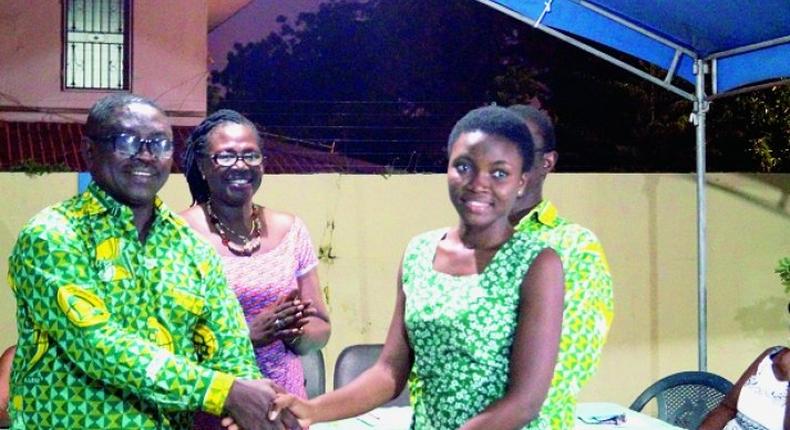 The Greater Accra Regional President of the Prempeh College Old Boys Association, Mr Kwabena Nyarko (left), presenting a cheque to Naa Adoley Saka (right ), a student of Achimota School in Accra
