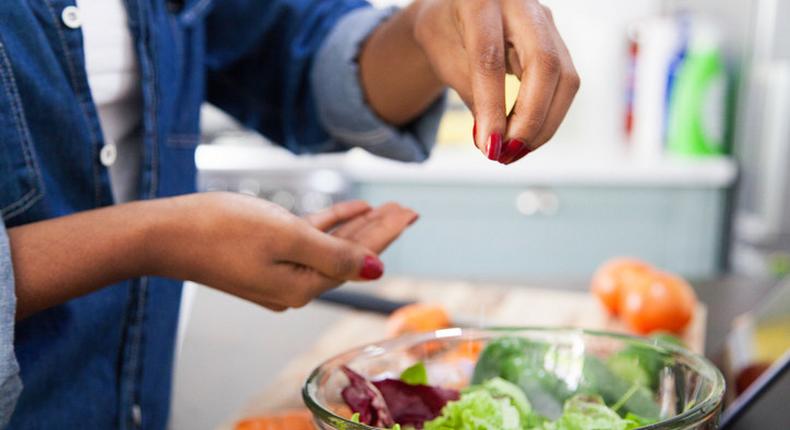 Lady seasoning vegetables