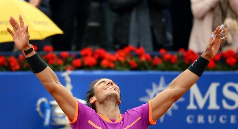 Spanish tennis player Rafael Nadal celebrates his victory over Austrian tennis player Dominic Thiem at the end of the ATP Barcelona Open on April 30, 2017