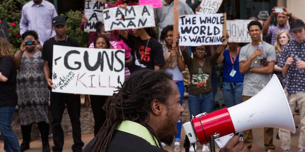 People participate in a rally to protest the death of Walter Scott outside City Hall on April 8, 2015 in North Charleston, South Carolina.