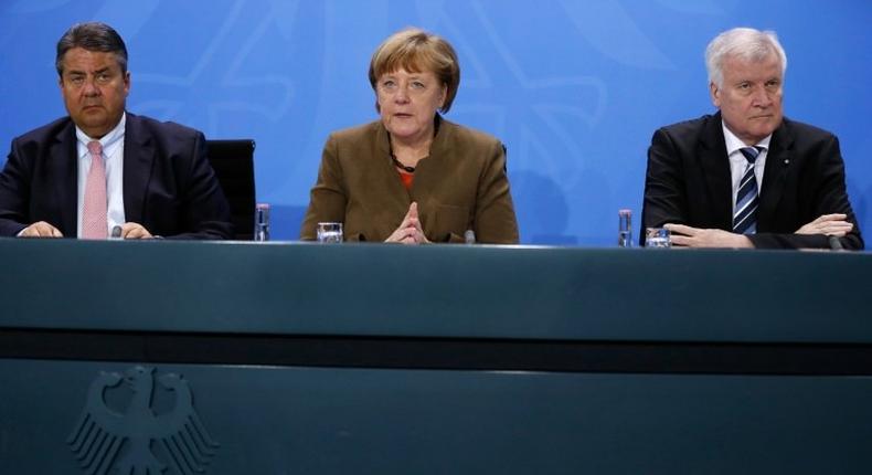 German Vice Chancellor Sigmar Gabriel (L), German Chancellor Angela Merkel (C) and leader of the Christian Social Union (CSU) Horst Seehofer are divided over who to nominate as a potential successor to President Joachim Gauck