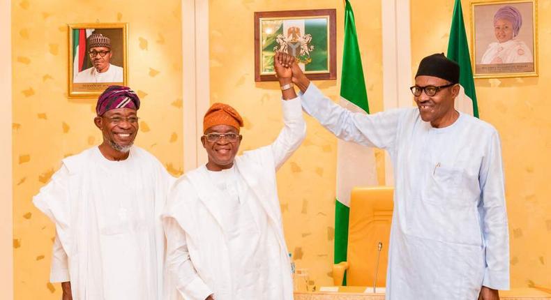 L-R: Governor Rauf Aregbesola, Gboyega Oyetola and President Muhammadu Buhari