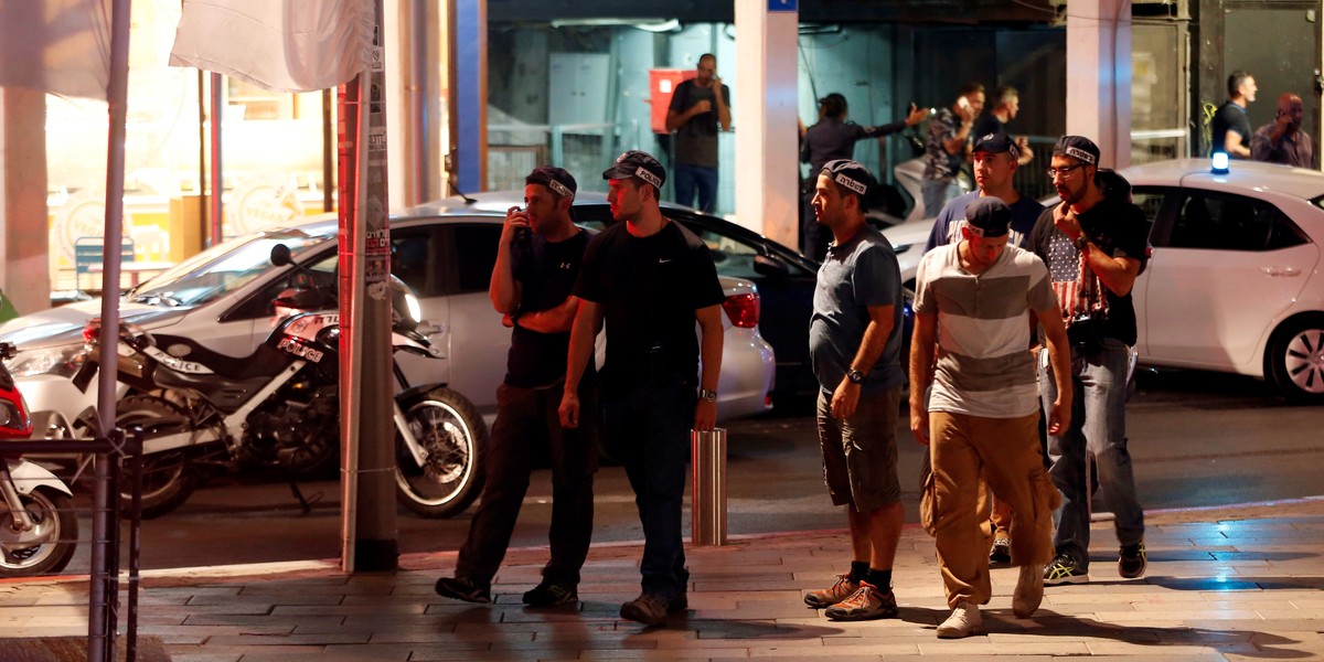 Israeli security personnel secure the area where a shooting took place in the center of Tel Aviv.