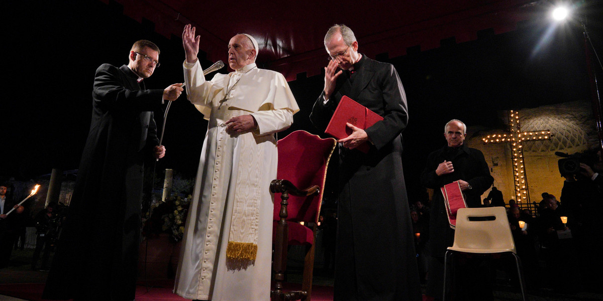 Pope Francis presides over the Via Crucis (Way of the Cross) torchlight procession on Good Friday, in front of Rome's Colosseum, in Rome